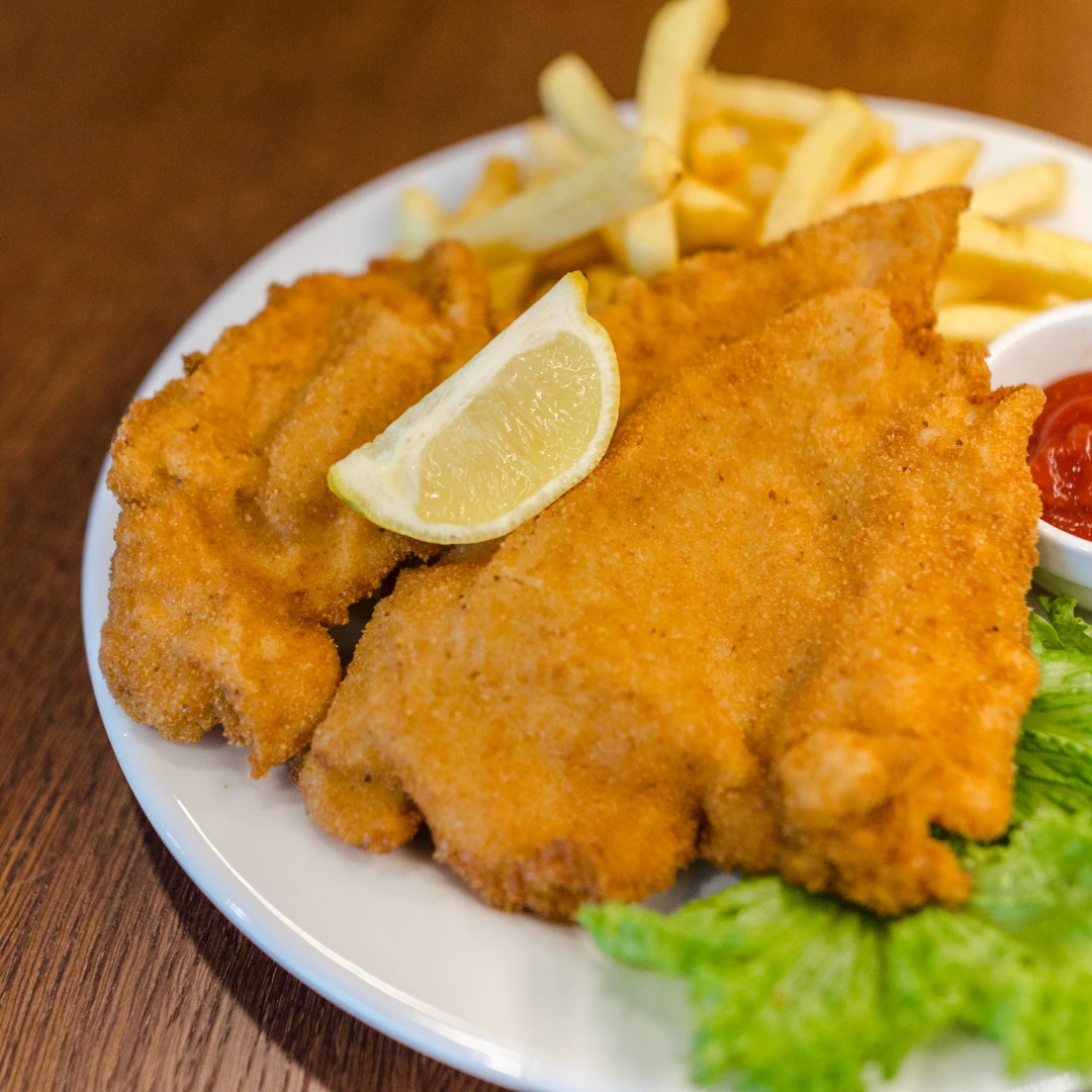 Paniertes Schnitzel Bergisch: Knusprig mit Haferflocken und Kräutern
