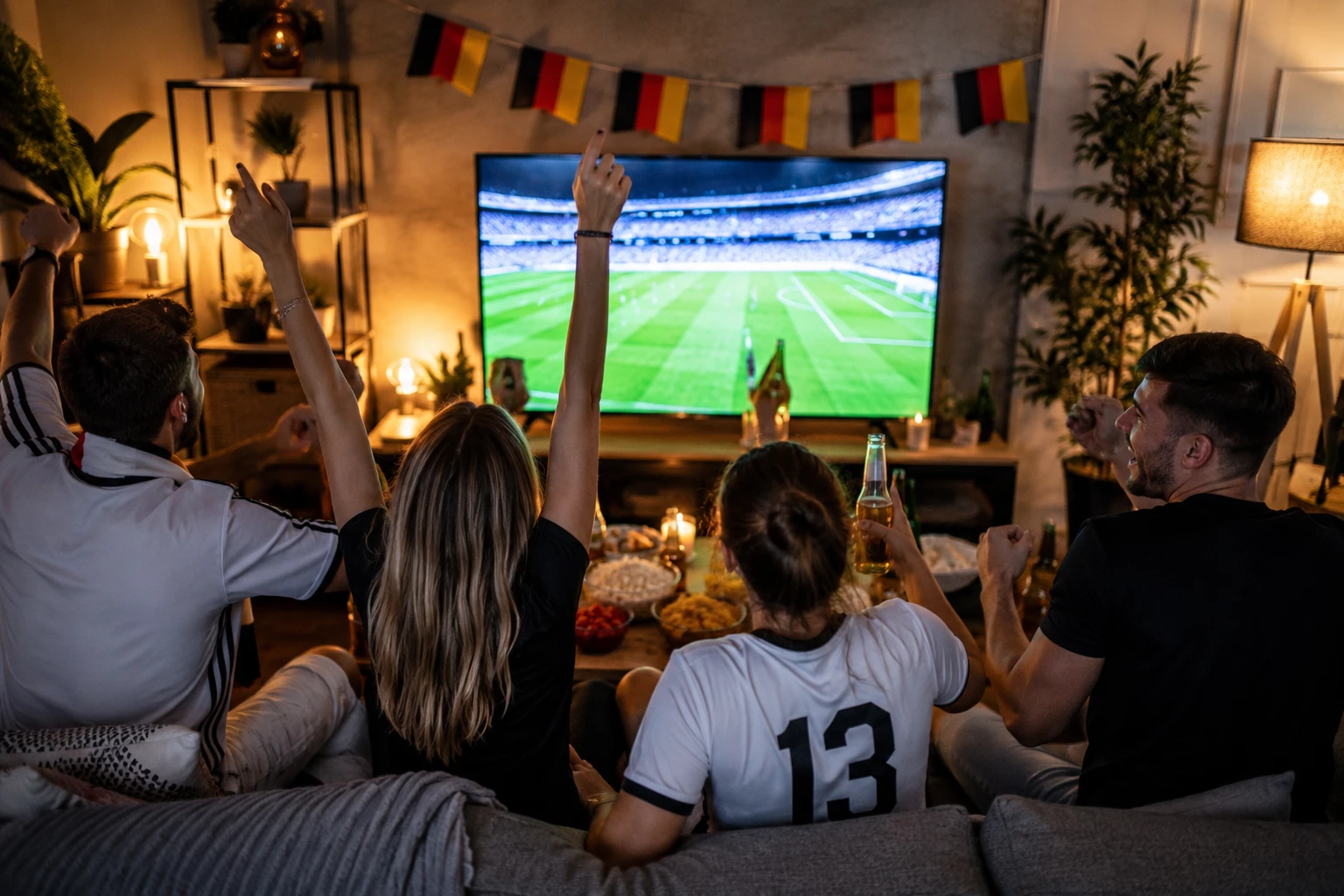 Gemeinsam jubeln, lachen und mitfiebern – Public Viewing zuhause wird mit Freunden zum echten Highlight. (KI-generiert)